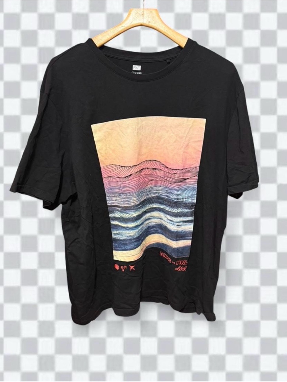 F&F (Tesco's clothing brand), featuring a pastel sunset and wave landscape tee